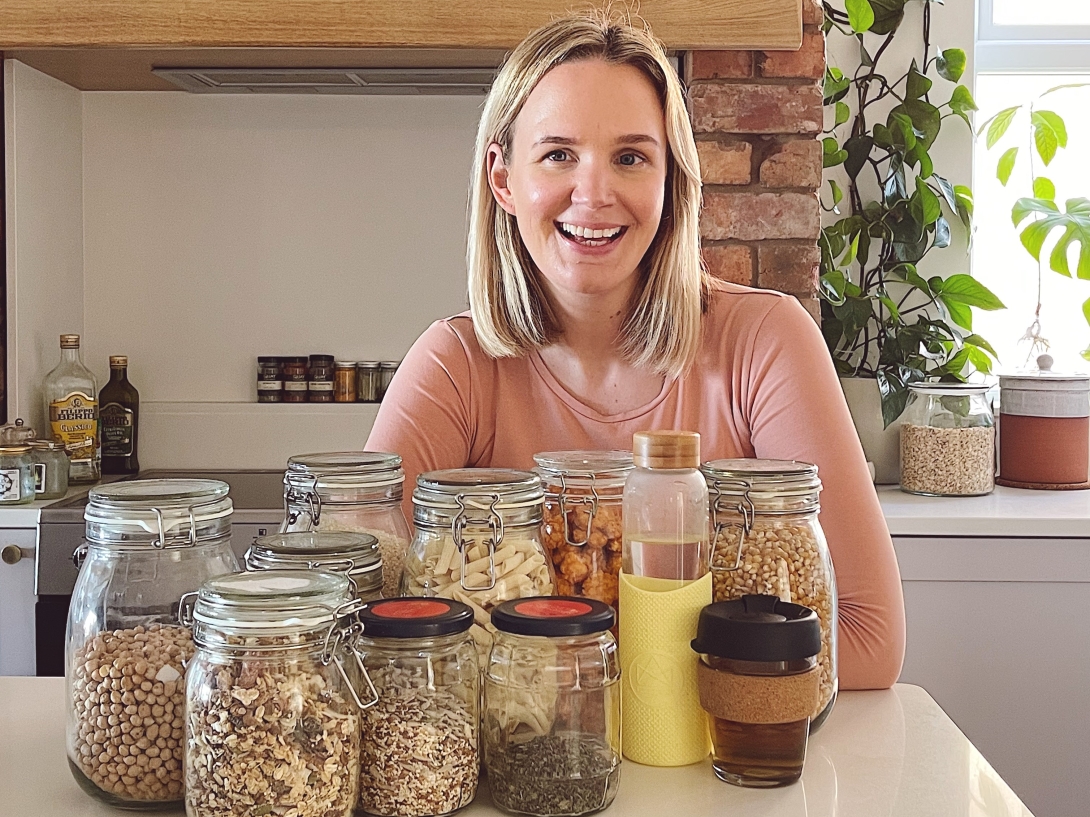 Kate from My Plastic Free Home poses with some glass jars
