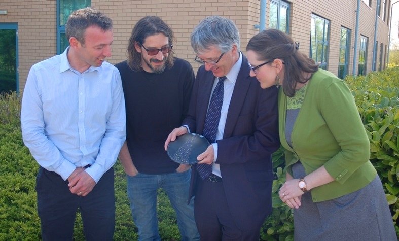 British Glass staff admire the glass plaque awarded to Simon Slade of NSG for his work with the International Commission on Glass’ Technical Committee 13